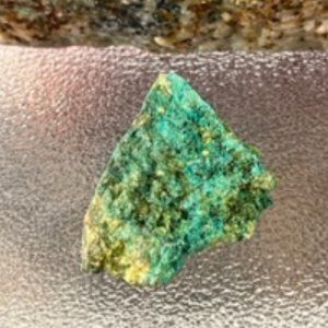 A Raw Turquoise / Chrysocolla stone hand minded in Tucson with layered shades